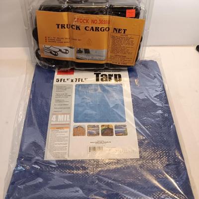Brand new Truck cargo net with a new 5-foot x 7-foot blue colored tarp