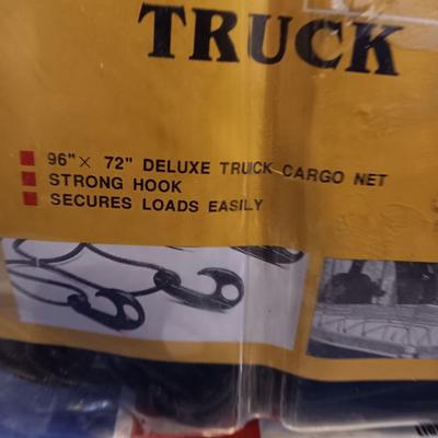Brand new Truck cargo net with a new 5-foot x 7-foot blue colored tarp