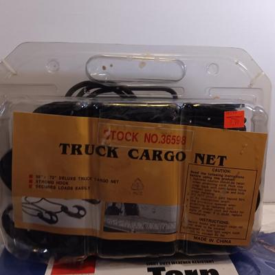 Brand new Truck cargo net with a new 5-foot x 7-foot blue colored tarp