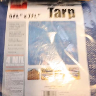 Brand new Truck cargo net with a new 5-foot x 7-foot blue colored tarp