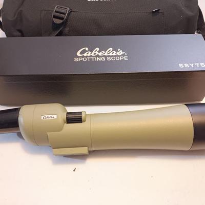 Cabela's non-Armor 75mm SSY76 spotting scope with padded storage case and original box.