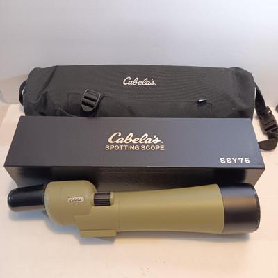 Cabela's non-Armor 75mm SSY76 spotting scope with padded storage case and original box.