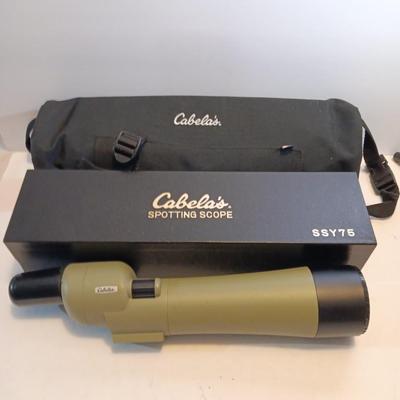 Cabela's non-Armor 75mm SSY76 spotting scope with padded storage case and original box.