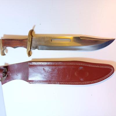Large wooden handled Bowie knife- with Pakistan tooled leather sheath.