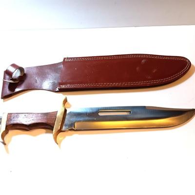 Large wooden handled Bowie knife- with Pakistan tooled leather sheath.