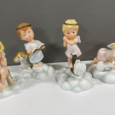 8 Almost Angels porcelain figurines