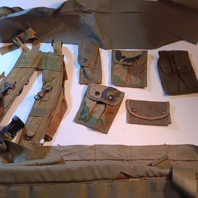 Large lot of Military issued Camouflage bags and pouches and ammunition belts.