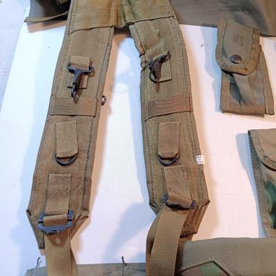 Large lot of Military issued Camouflage bags and pouches and ammunition belts.