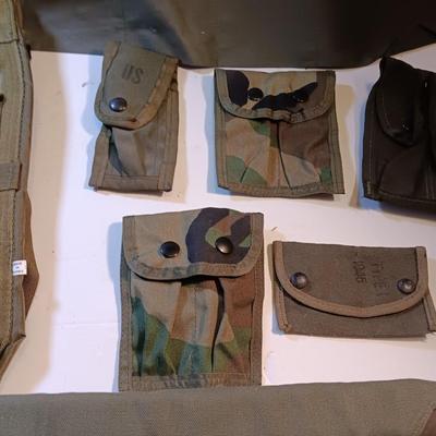 Large lot of Military issued Camouflage bags and pouches and ammunition belts.