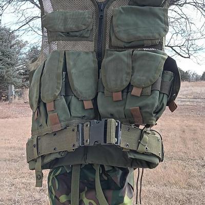 Military issued tactical vest with accessories.