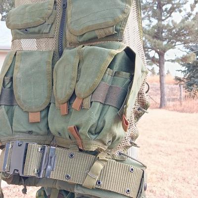 Military issued tactical vest with accessories.
