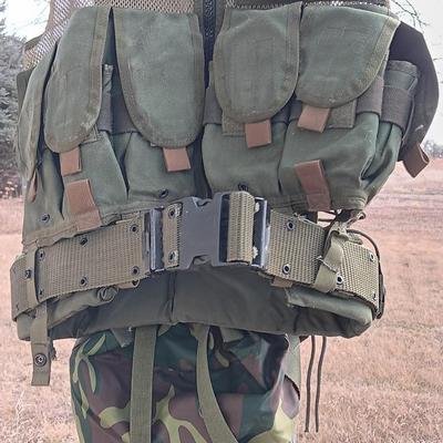 Military issued tactical vest with accessories.