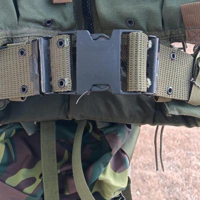Military issued tactical vest with accessories.