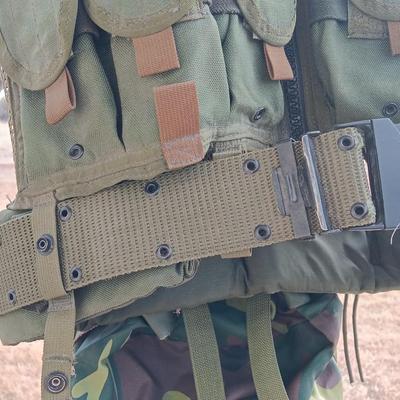 Military issued tactical vest with accessories.