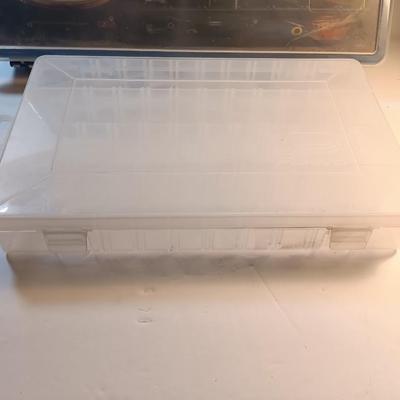 Plano plastic storage organizing boxes for fishing tackle.
