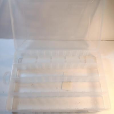 Plano plastic storage organizing boxes for fishing tackle.