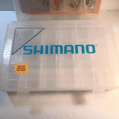 Shimano and Plano stowaway plastic organizing boxes for fishing tackle.