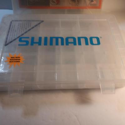 Shimano and Plano stowaway plastic organizing boxes for fishing tackle.
