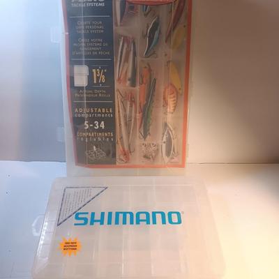 Shimano and Plano stowaway plastic organizing boxes for fishing tackle.