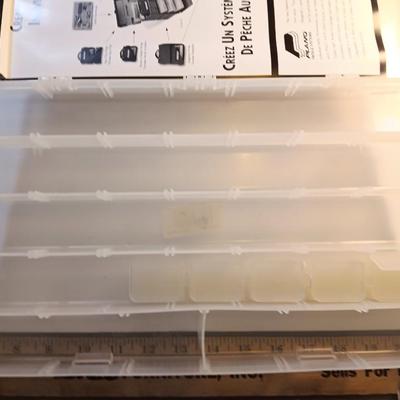 Shimano and Plano stowaway plastic organizing boxes for fishing tackle.
