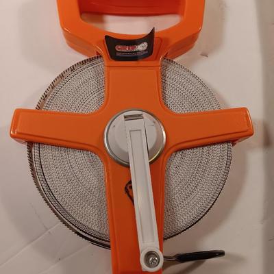 GRIP fabric tape measure with fiberglass handled 3.3 LB sledge hammer.
