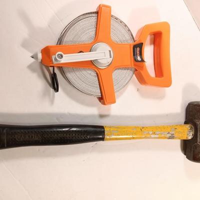 GRIP fabric tape measure with fiberglass handled 3.3 LB sledge hammer.