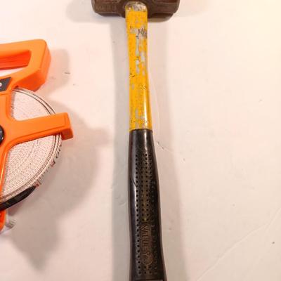 GRIP fabric tape measure with fiberglass handled 3.3 LB sledge hammer.