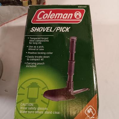 Vintage thermos with raincoat aluminum drinking cup and a folding coleman shovel pick