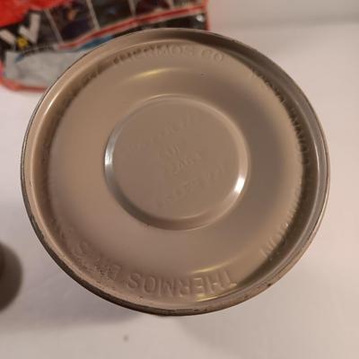 Vintage thermos with raincoat aluminum drinking cup and a folding coleman shovel pick