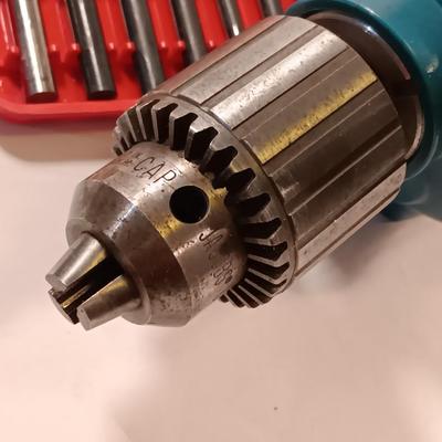 Makita 1/2" electric drill with assortment of drill bits