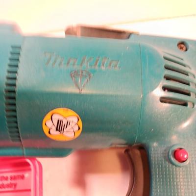 Makita 1/2" electric drill with assortment of drill bits