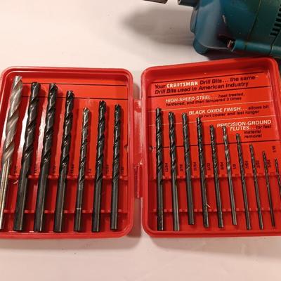 Makita 1/2" electric drill with assortment of drill bits