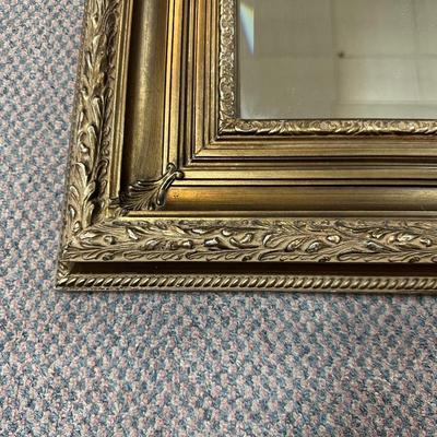 BEAUTIFUL BEVELED MIRROR WITH A BROWN ORNATE FRAME