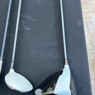 Golf clubs by pinging, two lots of golf bags with golf clubs