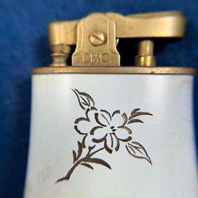 VINTAGE ENAMELED AND INCISED CONTINENTAL BRAND LIGHTER