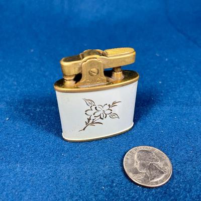 VINTAGE ENAMELED AND INCISED CONTINENTAL BRAND LIGHTER