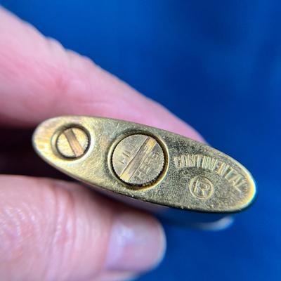 VINTAGE ENAMELED AND INCISED CONTINENTAL BRAND LIGHTER