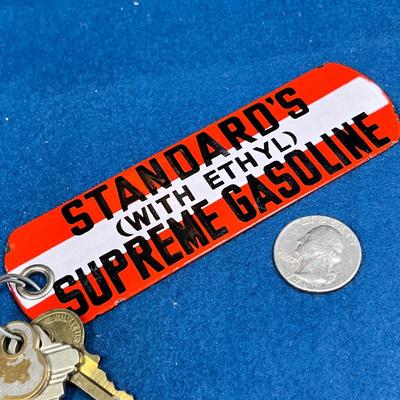 VINTAGE ENAMELED GAS STATION RESTROOM KEY? FOB, STANDARD'S SUPREME GASOLINE