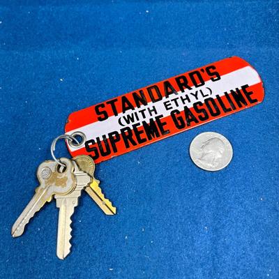 VINTAGE ENAMELED GAS STATION RESTROOM KEY? FOB, STANDARD'S SUPREME GASOLINE