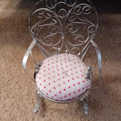 Plain chair with polka dot pin cushion