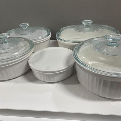 5 white Corning ware casserole dishes