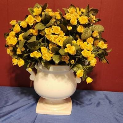 White vase with yellow flowers