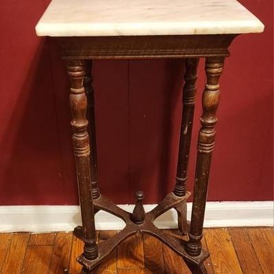 Tall marble top end table - wobbly