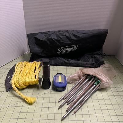 Coleman Bag, Stakes, Rope, and 2 Flashlights