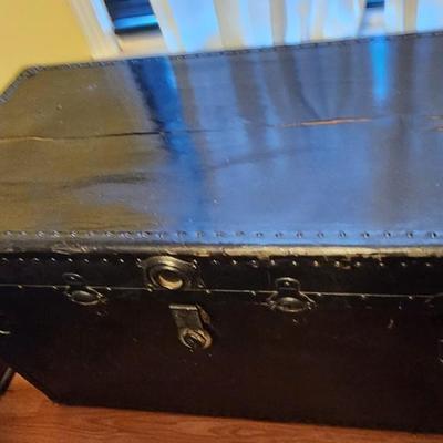 Large black flat top trunk