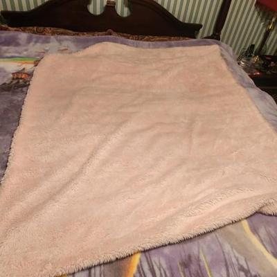 Pink fuzzy throw blanket