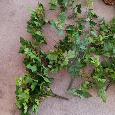 Faux ivy vines with basket of faux greenery and two wicker baskets