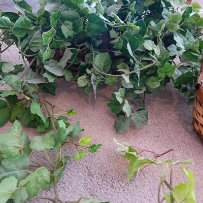 Faux ivy vines with basket of faux greenery and two wicker baskets