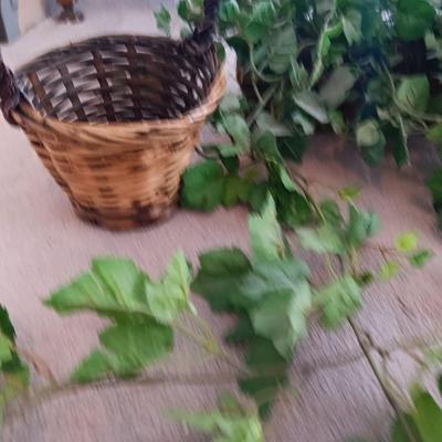 Faux ivy vines with basket of faux greenery and two wicker baskets