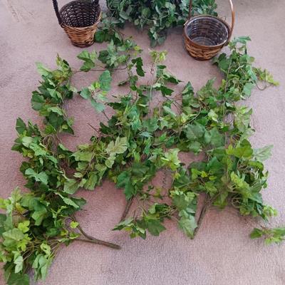 Faux ivy vines with basket of faux greenery and two wicker baskets